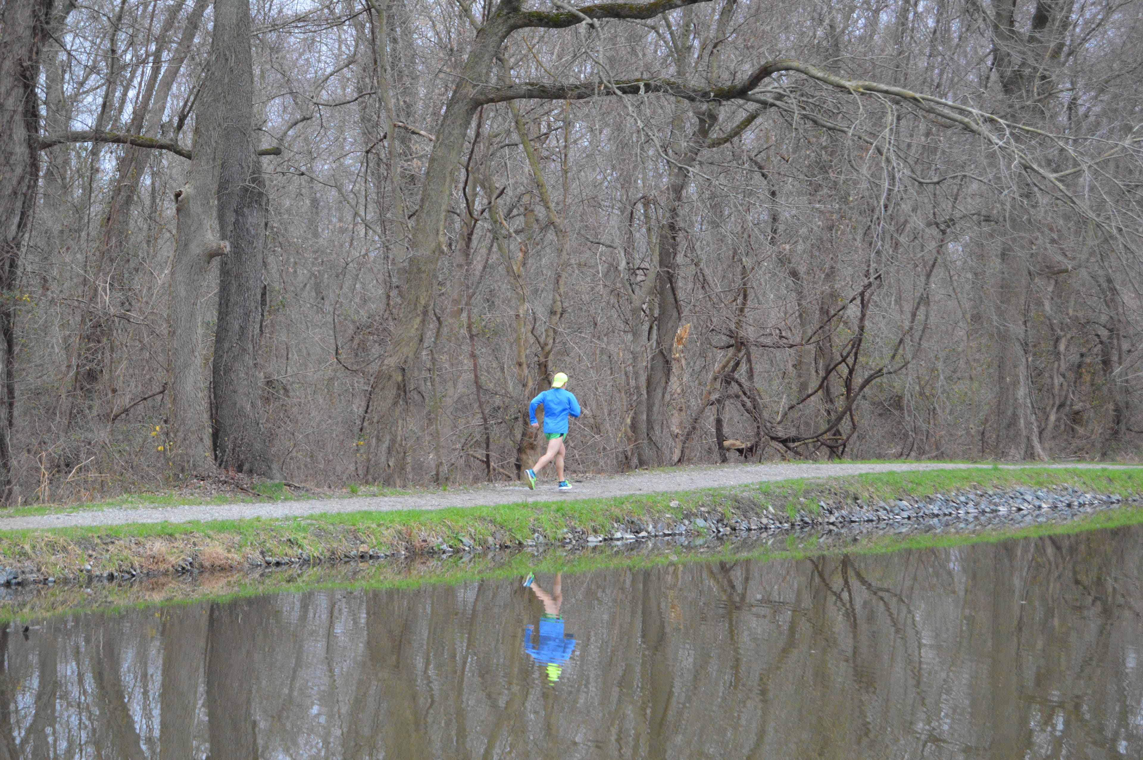 Runner jogging along the Schuylkill Canal towpath
